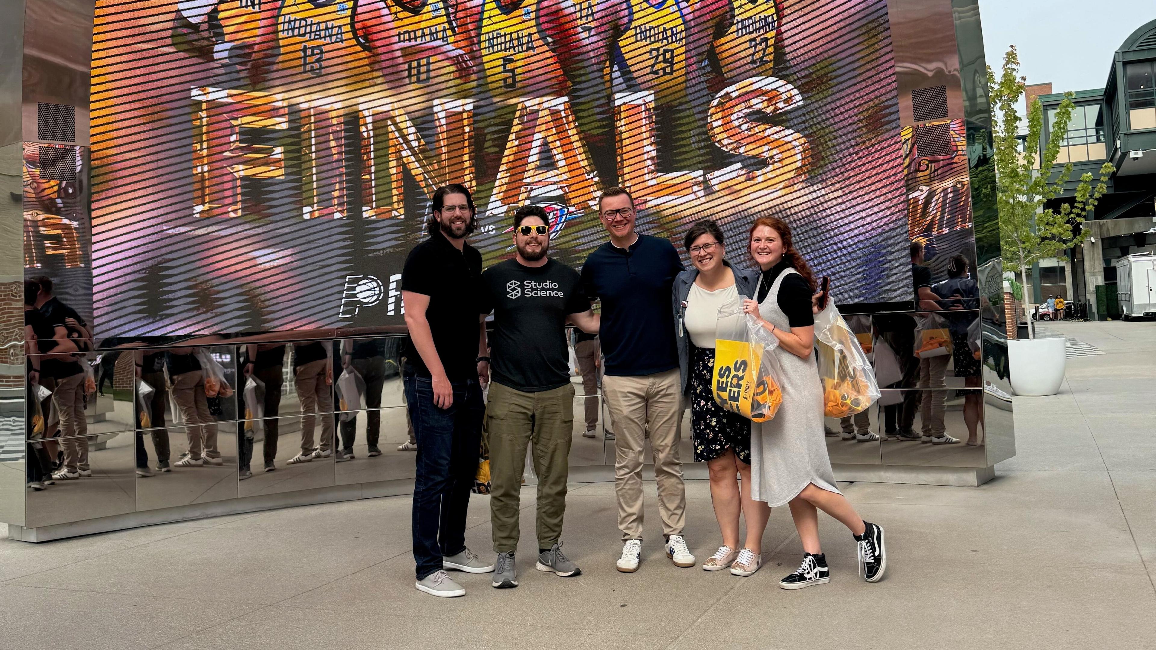 Studio Science's Michelle Berron with team members at the NBA Finals for the Indiana Pacers.