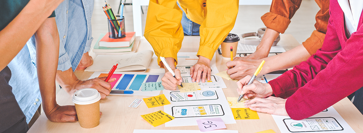 A team collaborating on a mobile app design.