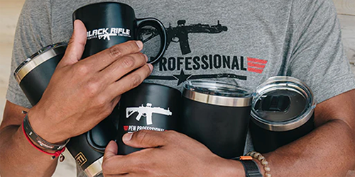 Man holding Black Rifle Coffee mugs.