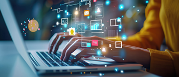 Woman typing on laptop with channel icons circling.